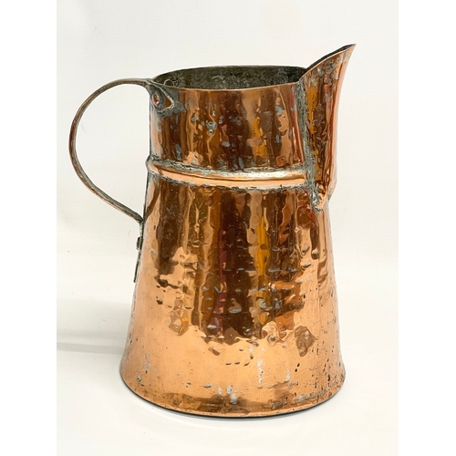 27 - A large Georgian copper jug. 20x25cm