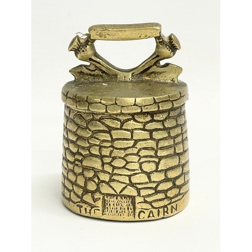 643 - An early 20th century Culloden Moor brass bell. The Cairn. Reg 786521. 8.5cm