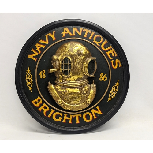 569 - A Navy Antiques, Brighton wall plaque. 45.5cm