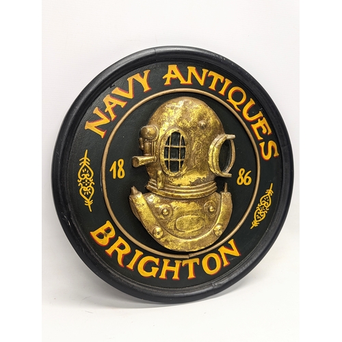 569 - A Navy Antiques, Brighton wall plaque. 45.5cm