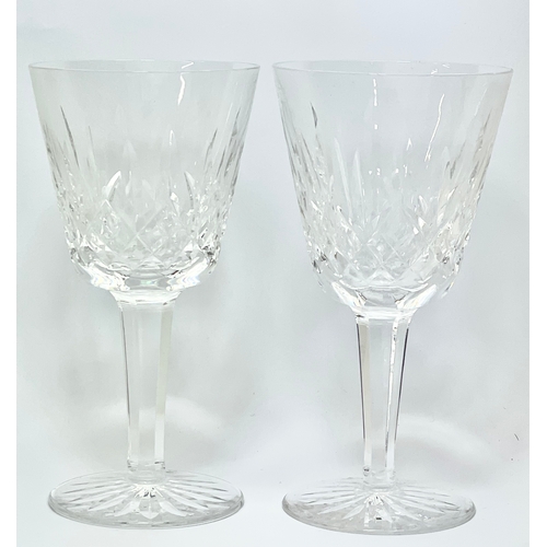 649 - A pair of Waterford Crystal ‘Lismore’ pattern wine glasses. 15cm.