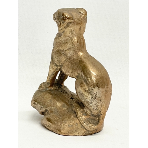 150 - An early 20th century heavy bronze lion figure. 9x10.5cm