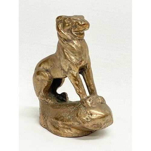 150 - An early 20th century heavy bronze lion figure. 9x10.5cm