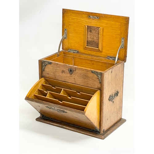 38 - An Edwardian oak desktop organiser. 32x20x27cm