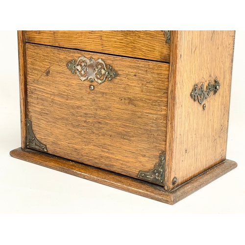 38 - An Edwardian oak desktop organiser. 32x20x27cm