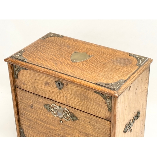 38 - An Edwardian oak desktop organiser. 32x20x27cm