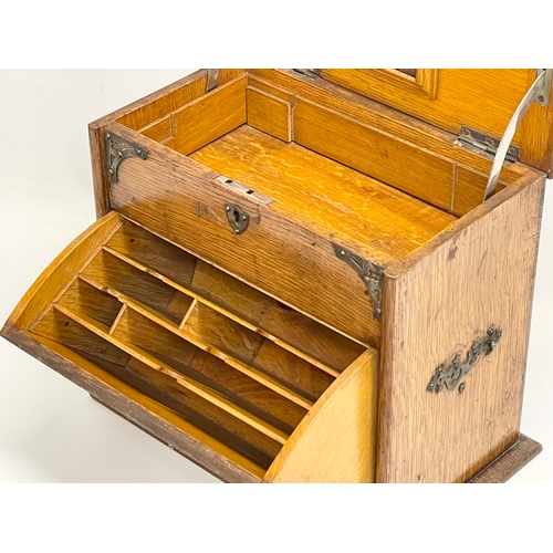 38 - An Edwardian oak desktop organiser. 32x20x27cm