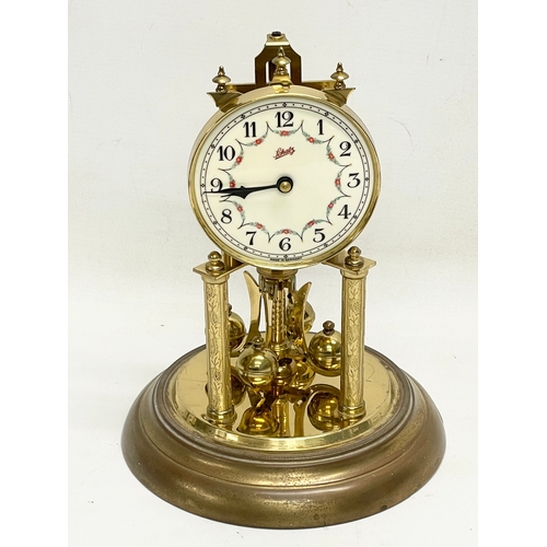 153 - A vintage German brass Anniversary clock by Schatz. 31cm