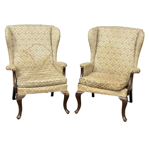 236 - A pair of vintage Parker Knoll wingback armchairs. Model number 918/19.