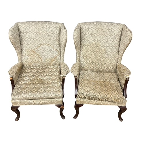 236 - A pair of vintage Parker Knoll wingback armchairs. Model number 918/19.