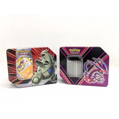 305 - A collection of Pokémon Trading Game Cards in Pokémon tins.