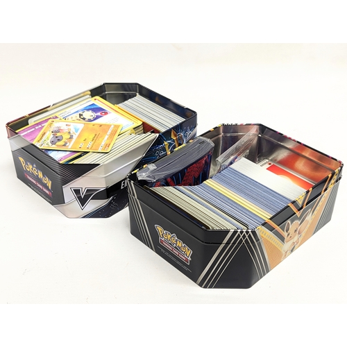 305 - A collection of Pokémon Trading Game Cards in Pokémon tins.