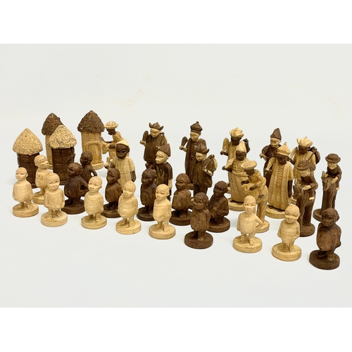 308 - A 34 Nigerian carved thorn wood chess pieces.