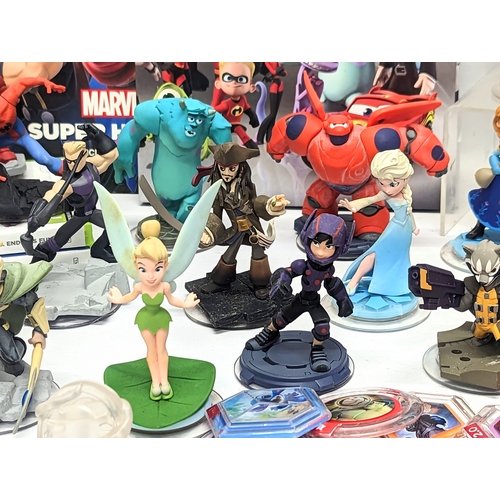 195 - A quantity of Disney Infinity Figures, including Disney princesses, Marvel, with 2 XBox 360 Disney I... 