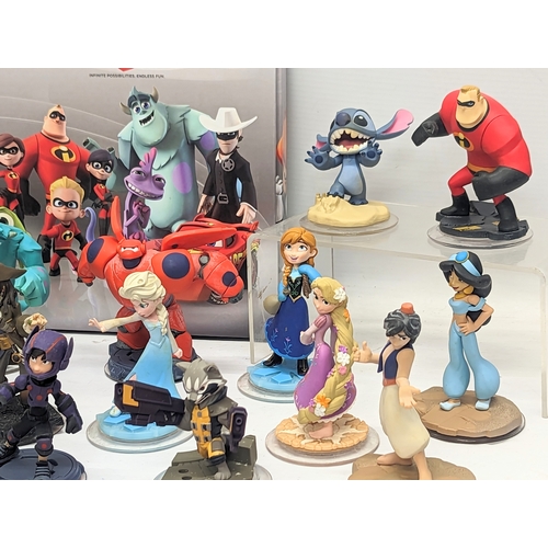 195 - A quantity of Disney Infinity Figures, including Disney princesses, Marvel, with 2 XBox 360 Disney I... 