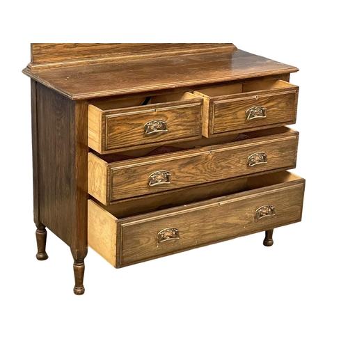 117 - An Edwardian oak gallery back chest of drawers with copper Art Nouveau handles. 107x46x117cm