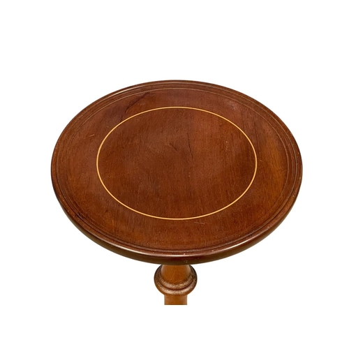 120 - An inlaid mahogany jardiniere stand. 88cm