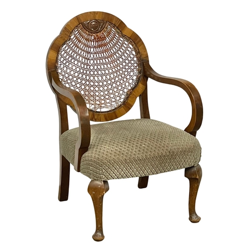 121 - A 1930’s bergere back armchair.