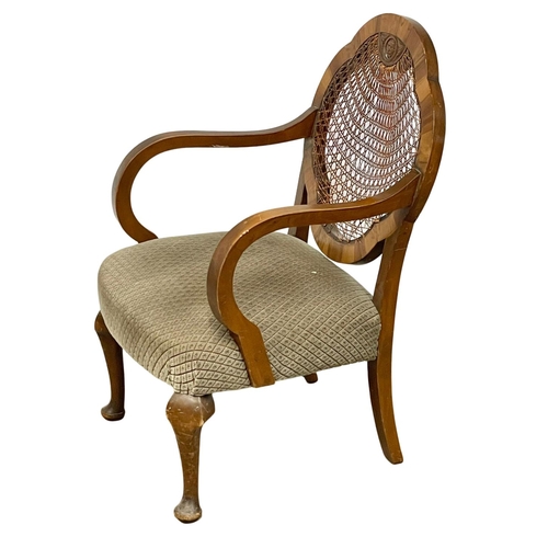 121 - A 1930’s bergere back armchair.