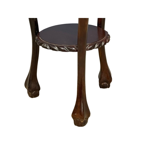 123 - A mahogany 2 tier plantstand. 35x37x72cm