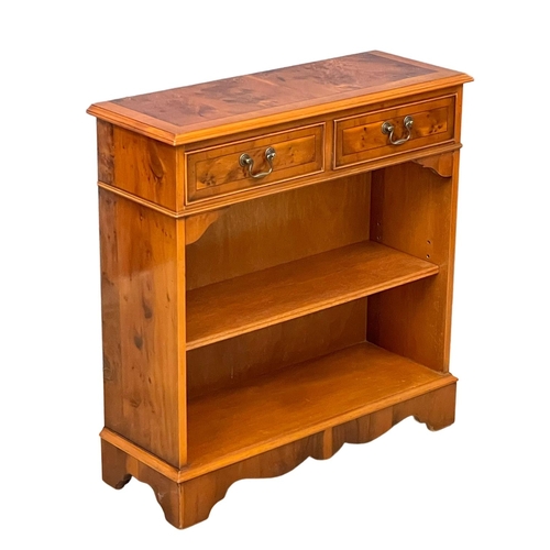 124 - A Yew Wood open bookcase with 2 drawers. 77x28x79.5cm