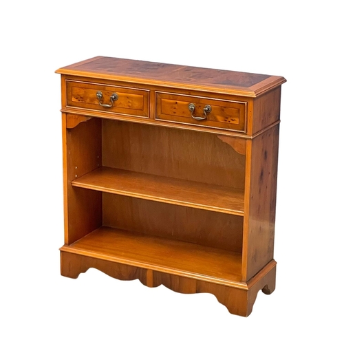 124 - A Yew Wood open bookcase with 2 drawers. 77x28x79.5cm