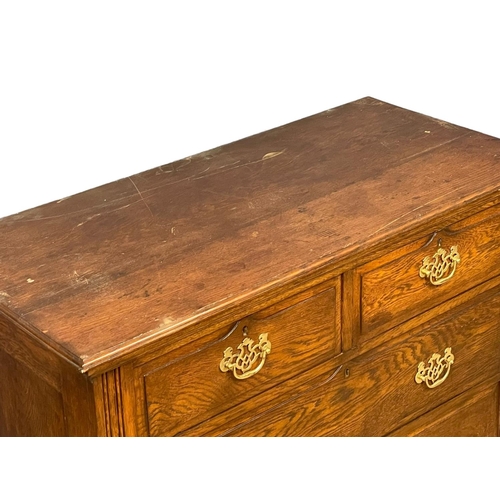 160 - An Edwardian oak chest of drawers with brass drop handles. 106x49.5x100.5cm