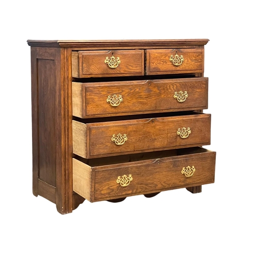 160 - An Edwardian oak chest of drawers with brass drop handles. 106x49.5x100.5cm