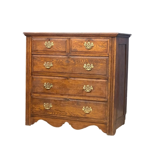 160 - An Edwardian oak chest of drawers with brass drop handles. 106x49.5x100.5cm