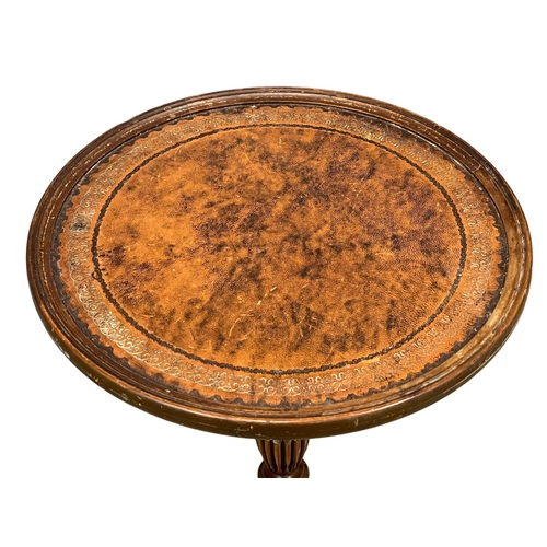 161 - 2 vintage mahogany wine tables with leather tops.