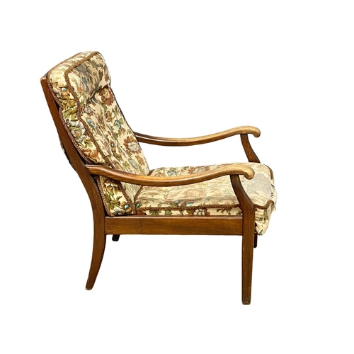 196 - A vintage oak armchair by Cintique.