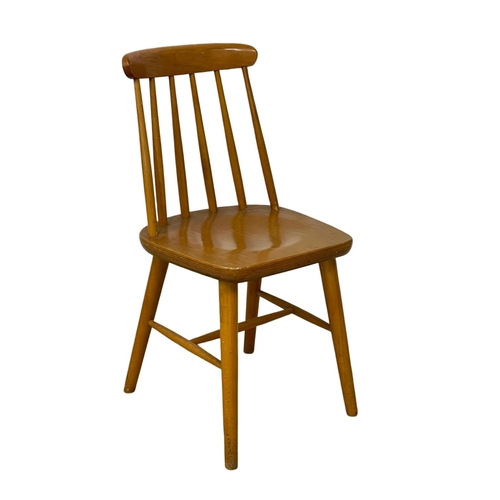 199 - A set of 4 vintage solid beech stick back kitchen chairs.