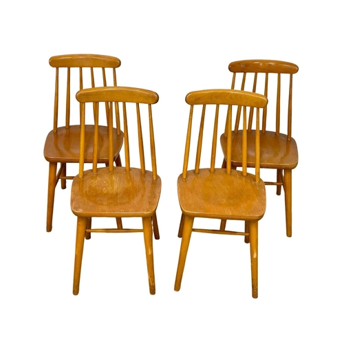 199 - A set of 4 vintage solid beech stick back kitchen chairs.