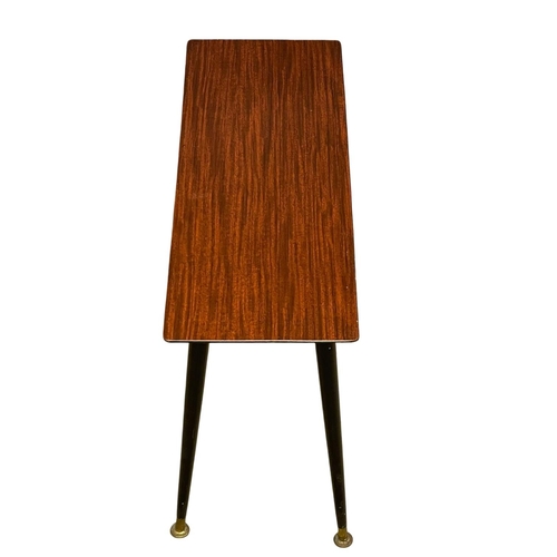 207 - A 1960’s Mid Century occasional table. 63x24x48cm