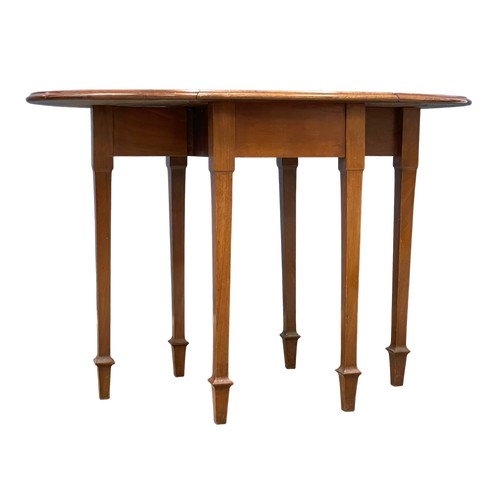 94 - A vintage Walnut drop leaf table. Open 115x71x76.5cm. Closed 49x71x76.5cm