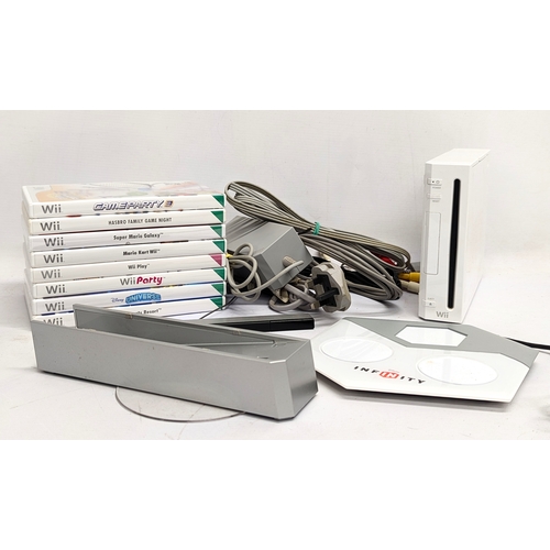 483 - An Nintendo Wii game console with Wii Games including Mario Kart, Super Mario Galaxy, Wii Sports Res... 