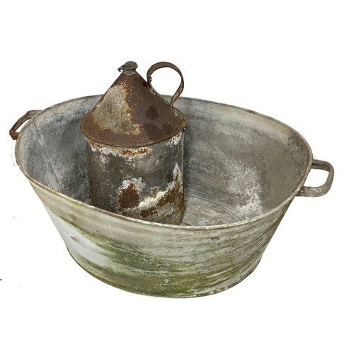 599 - A vintage galvanised basin and watering can etc.