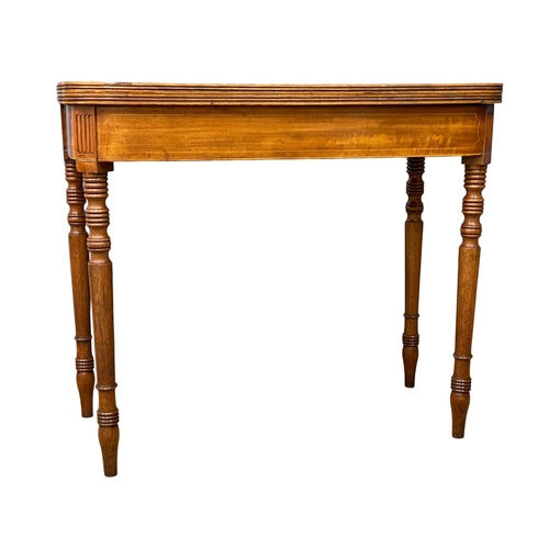 1696 - A George IV inlaid mahogany turnover tea table. Circa 1820. 87x45x74.5cm