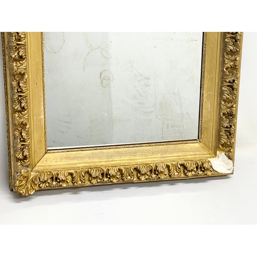 71 - A Victorian ornate gilt framed mirror. 68x63cm