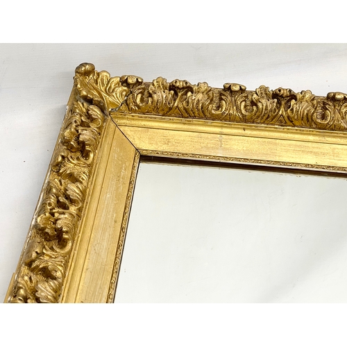 71 - A Victorian ornate gilt framed mirror. 68x63cm