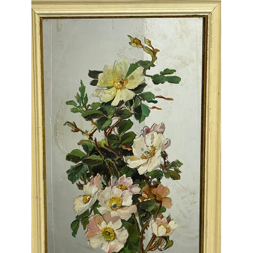 522 - A pair of early 20th century mirrors with hand painted flower decoration. Largest 42x89cm