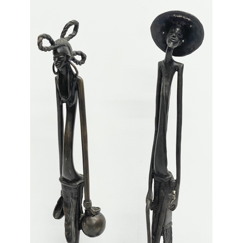 604 - A pair of early 20th century large African Bronze figures. 51cm