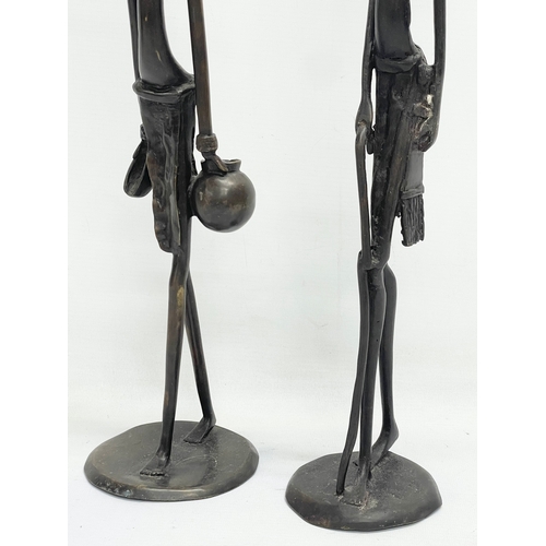 604 - A pair of early 20th century large African Bronze figures. 51cm