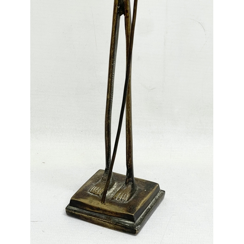 605 - A vintage large African Bronze figure. 58cm