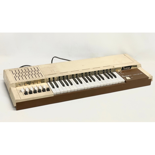 261 - A vintage Bontempi Electric Chord Organ and a Tannoy speaker.