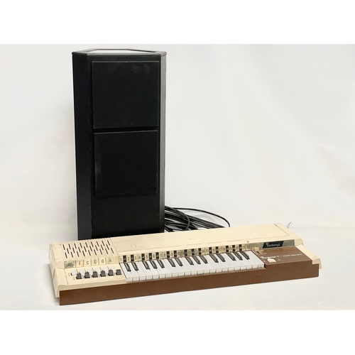 261 - A vintage Bontempi Electric Chord Organ and a Tannoy speaker.