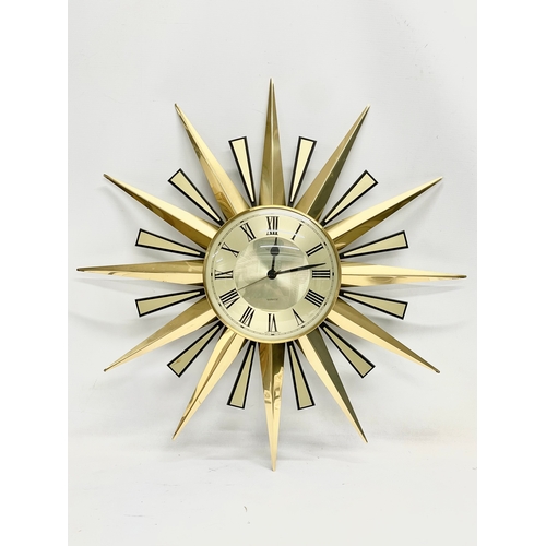 1 - A Mid Century sunburst clock by Metamic. 60cm