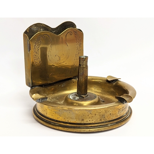 22 - A World War I brass Trench Art desktop ashtray, dating 1917. 11.5x9cm