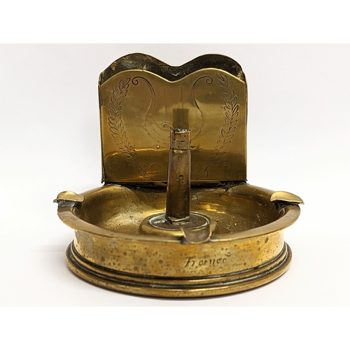 22 - A World War I brass Trench Art desktop ashtray, dating 1917. 11.5x9cm