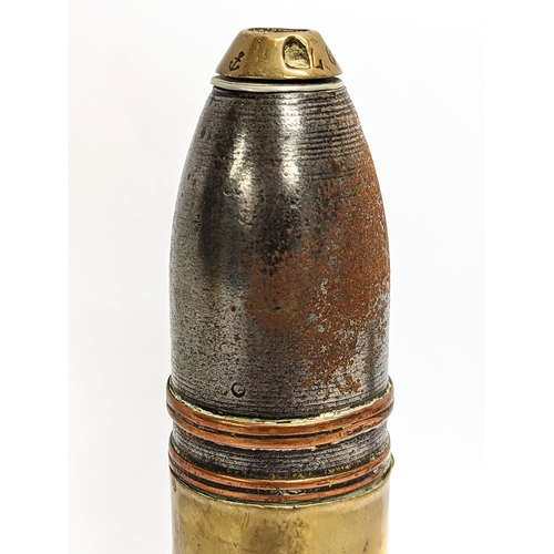 23 - A pair of early 20th century brass and copper heavy gun shells, deactivated. 17cm